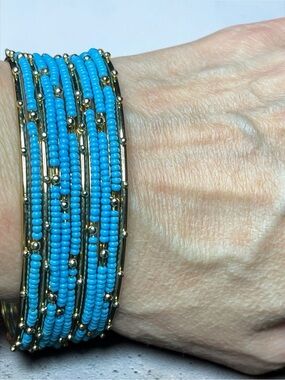 11 Bangle/Bracelets Turquoise-colored seed bead and gold-tone bangles